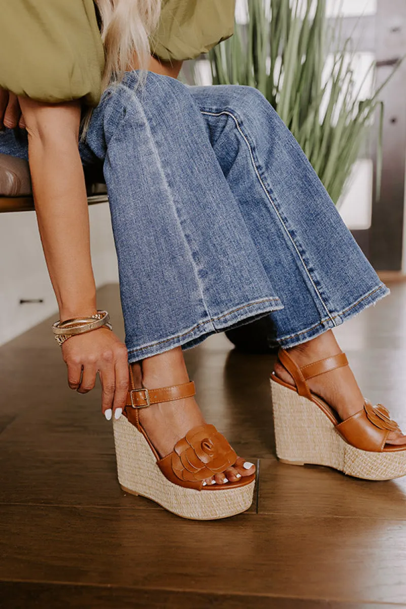 The Flora Faux Leather Wedge in Brown sold by Impressions