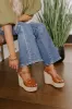 The Flora Faux Leather Wedge in Brown sold by Impressions