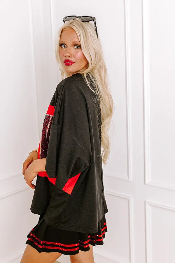 It's a Touch Down Sequin Oversized Tee in Black sold by Impressions product image thumbnail 5