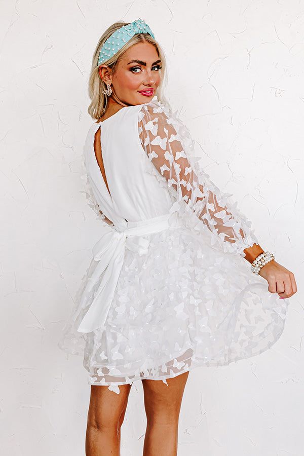 Butterfly Kisses Mini Dress in White sold by Impressions product image thumbnail 5