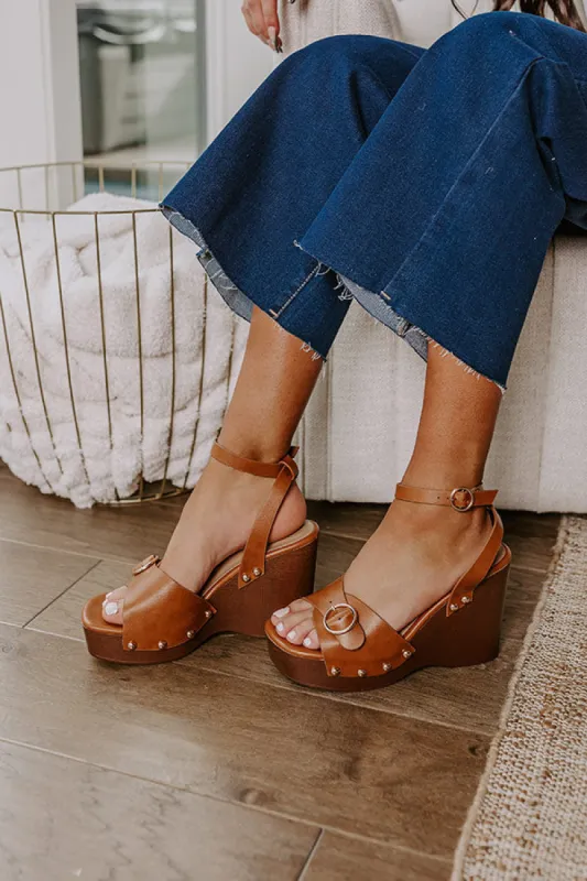 The Trisha Faux Leather Wedge in Brown sold by Impressions