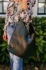 Girl On The Go Faux Leather Tote in Black sold by Impressions