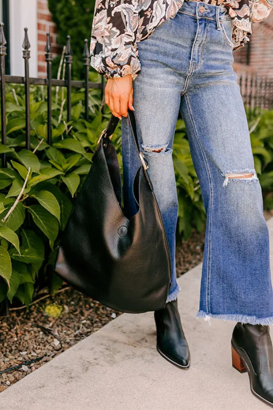Girl On The Go Faux Leather Tote in Black sold by Impressions