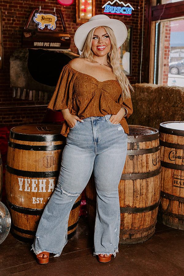 The Fleetwood High Waist Distressed Flare In Light Wash Curves sold by Impressions