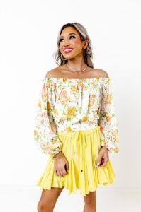 Spring Into Action Floral Top sold by Impressions