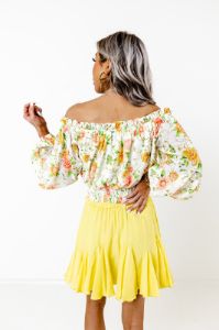 Spring Into Action Floral Top sold by Impressions