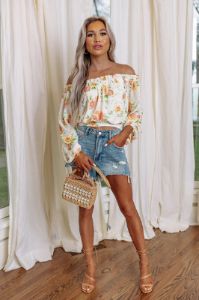 Spring Into Action Floral Top sold by Impressions
