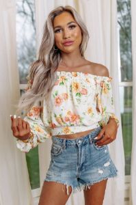 Spring Into Action Floral Top sold by Impressions