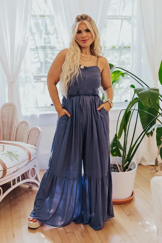 Desirable Destination Smocked Jumpsuit In Autumn Sky Curves sold by Impressions