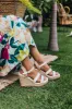 The Alana Faux Leather Wedge in White sold by Impressions