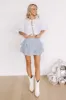 The Sloane Smocked Linen-Blend Mini Skirt sold by Impressions