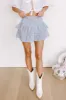 The Sloane Smocked Linen-Blend Mini Skirt sold by Impressions