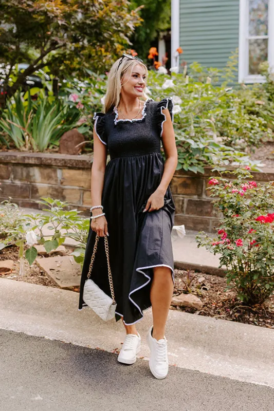 Mimosa Mingle Smocked Midi in Black sold by Impressions