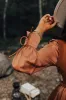 Gather The Courage Shift Dress In Camel sold by Impressions