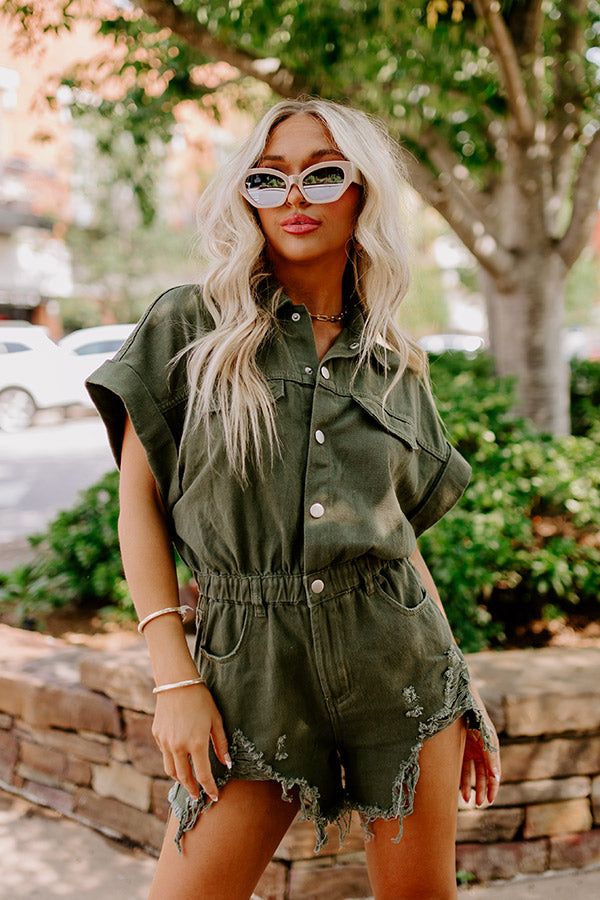 The Juni Distressed Denim Romper in Army Green sold by Impressions