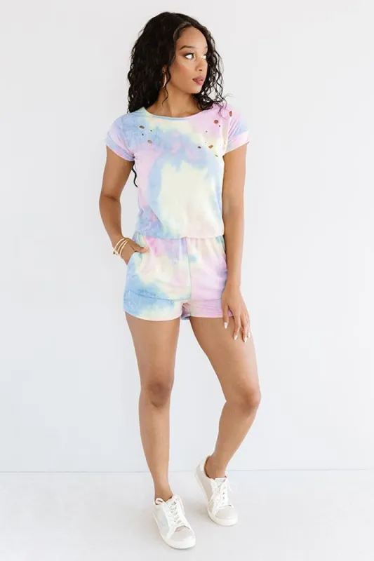 It's All Good Distressed Tie Dye Romper In Blue sold by Impressions