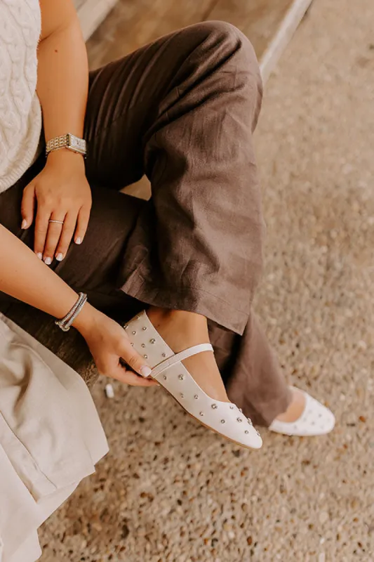 The Iris Rhinestone Embellished Faux Leather Flats in Cream sold by Impressions