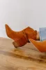 The Emerson Faux Suede Cowboy Boot in Maple sold by Impressions
