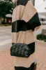 Uptown Chic Faux Leather Purse in Black sold by Impressions