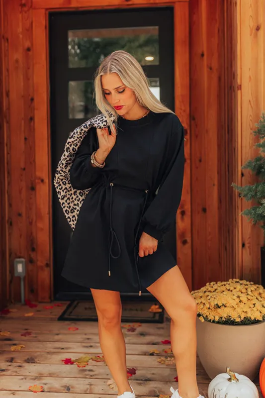 Latte Run Drawstring Mini Dress in Black sold by Impressions