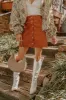 The Sienna High Waist Corduroy Mini Skirt in Rust sold by Impressions