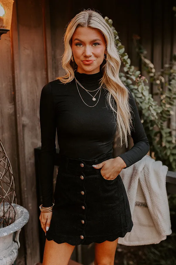 The Sienna High Waist Corduroy Mini Skirt in Black sold by Impressions product image thumbnail 3