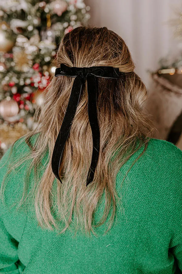 The Alice Long Velvet Bow Hair Clip in Black sold by Impressions