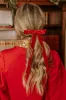 The Alice Long Velvet Bow Hair Clip in Red sold by Impressions