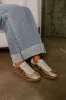 The Miley Metallic Sneaker in Gold sold by Impressions