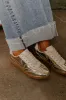 The Miley Metallic Sneaker in Gold sold by Impressions