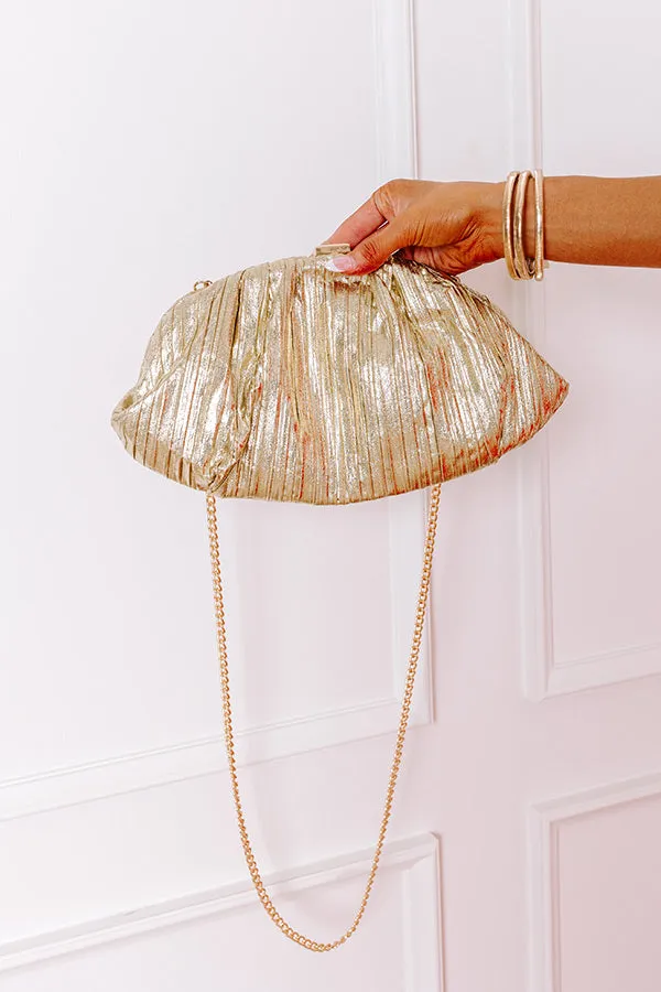 Golden Moment Metallic Clutch sold by Impressions