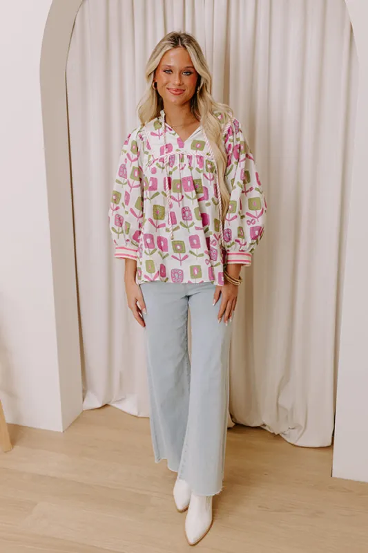 Spring Energy Floral Top sold by Impressions