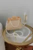 Affectionate Allure Woven Clutch sold by Impressions