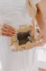 Affectionate Allure Woven Clutch sold by Impressions