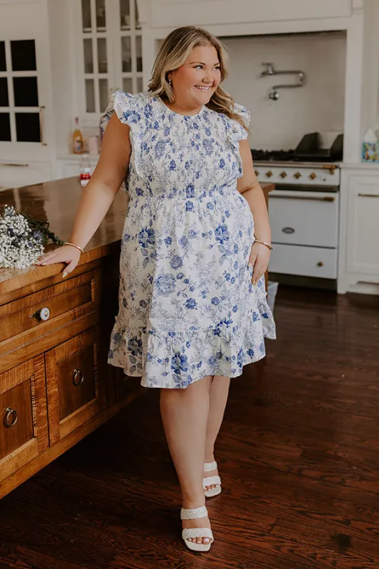 Whimsical Daydream Floral Smocked Mini Dress Curves sold by Impressions