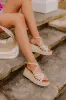 The Kinsley Faux Leather Wedge in Gold sold by Impressions
