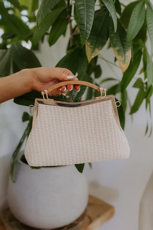 Casual Couture Woven Purse sold by Impressions