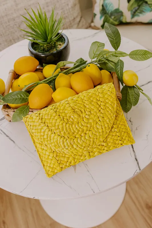 Sunny Refresh Woven Clutch in Yellow sold by Impressions