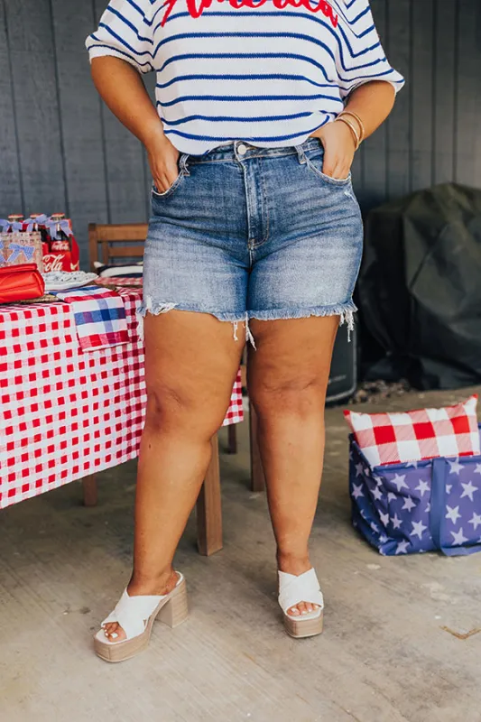 Risen Maeve High Waist Frayed Shorts in Medium Wash Curves sold by Impressions