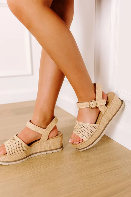 The Arabella Raffia Woven Wedge sold by Impressions