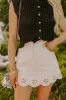 The Nora High Waist Eyelet Mini Skirt sold by Impressions