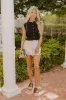The Nora High Waist Eyelet Mini Skirt sold by Impressions