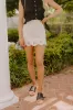 The Nora High Waist Eyelet Mini Skirt sold by Impressions