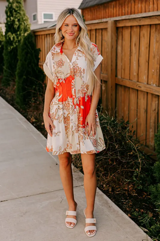 Cruise Ready Floral Mini Dress in Tangerine sold by Impressions