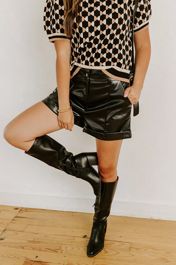 The Cecily High Waist Faux Leather Shorts in Black sold by Impressions