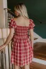 Cider Season Smocked Mini Dress in Wine sold by Impressions