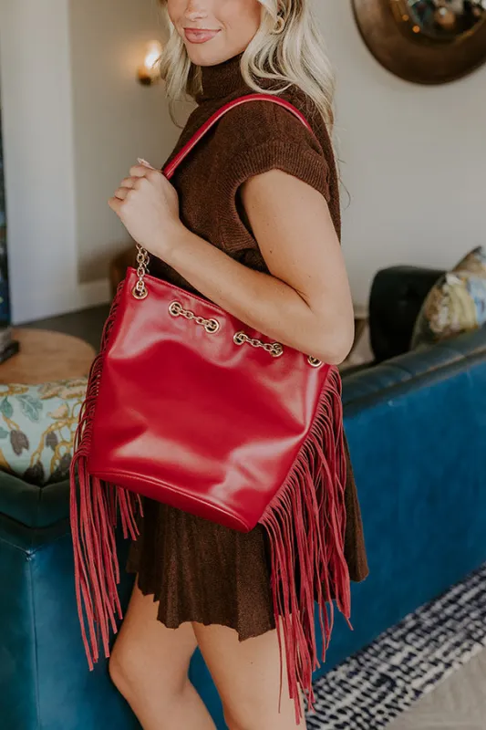 Chic Moment Faux Leather Fringe Purse in Red sold by Impressions