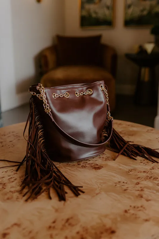 Chic Moment Faux Leather Fringe Purse in Chestnut sold by Impressions