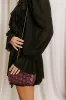 The Rya Faux Leather Woven Clutch in Windsor Wine sold by Impressions
