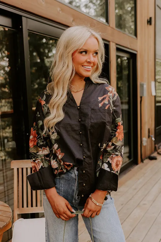 Uptown Poise Floral Top in Black sold by Impressions